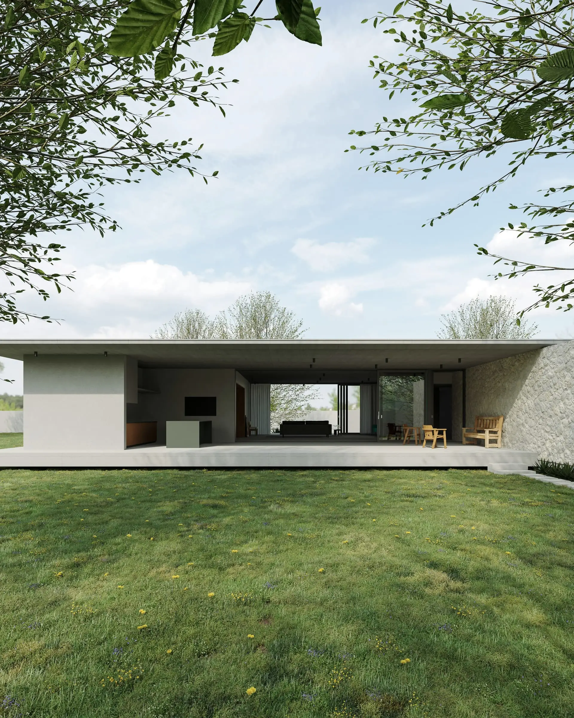 A low flat-roofed concrete house with an open room in its centre, seen across a lawn.